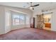 Spacious main bedroom featuring ample natural light and a sliding barn door to bathroom at 1563 E Racine Dr, Casa Grande, AZ 85122