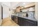 Wet bar featuring wine storage, custom backsplash and built-in beverage fridge at 16008 N 60Th St, Scottsdale, AZ 85254