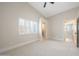 Bright bedroom with neutral carpet, plantation shutters, and an ensuite bathroom at 16008 N 60Th St, Scottsdale, AZ 85254