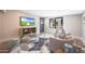 A bonus room includes a mounted television, shelving, and an indoor tent at 16008 N 60Th St, Scottsdale, AZ 85254