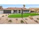 Beautiful home with red-tile roof, well-manicured artificial lawn, and desert landscaping at 16008 N 60Th St, Scottsdale, AZ 85254