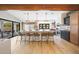 Modern kitchen with island, stainless steel appliances, and hardwood floors at 16008 N 60Th St, Scottsdale, AZ 85254