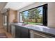 Kitchen with a large window and stainless steel appliances at 16008 N 60Th St, Scottsdale, AZ 85254