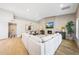 Bright living room features a large sectional sofa, fireplace, and hardwood floors at 16008 N 60Th St, Scottsdale, AZ 85254