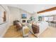 Living room with a beam, fireplace and views into the kitchen at 16008 N 60Th St, Scottsdale, AZ 85254