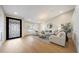 Bright living room with elegant decor, hardwood floors, and a decorative front door at 16008 N 60Th St, Scottsdale, AZ 85254