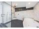 Modern bathroom with walk-in shower, soaking tub, and luxury finishes at 16008 N 60Th St, Scottsdale, AZ 85254