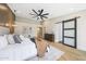 Spacious bedroom with a sliding barn door and stylish decor at 16008 N 60Th St, Scottsdale, AZ 85254