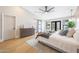 Large bedroom featuring light filled windows and wood floors at 16008 N 60Th St, Scottsdale, AZ 85254