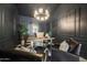 Stylish office featuring black paneled walls, decorative lighting, modern desk and chairs, and checkered floor at 16008 N 60Th St, Scottsdale, AZ 85254