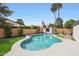 Enjoy the Arizona sunshine in this backyard with a sparkling pool and mature landscaping at 16008 N 60Th St, Scottsdale, AZ 85254