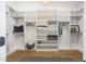 Spacious walk-in closet with wooden floors and custom shelving at 16008 N 60Th St, Scottsdale, AZ 85254