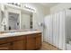 Bathroom featuring double sinks, and a shower-tub combination at 1601 S 215Th Dr, Buckeye, AZ 85326