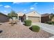 Charming single-story home with desert landscaping, a two-car garage, and inviting curb appeal at 1601 S 215Th Dr, Buckeye, AZ 85326