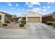 Inviting single-story home featuring low-maintenance landscaping and a two-car garage at 1601 S 215Th Dr, Buckeye, AZ 85326