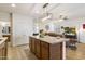 Open kitchen view showing breakfast bar and view to the living room at 1601 S 215Th Dr, Buckeye, AZ 85326