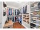 Large walk-in closet featuring built-in shelving for clothing, shoes and accessories at 16631 E El Lago Blvd # 212, Fountain Hills, AZ 85268