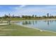 Community lake and park with lush green grass and picnic areas on a bright sunny day at 16631 E El Lago Blvd # 212, Fountain Hills, AZ 85268