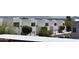 Exterior shot of modern townhomes with white garages, well-maintained landscaping, and desert mountain views at 16631 E El Lago Blvd # 212, Fountain Hills, AZ 85268