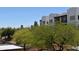 Community featuring townhomes with desert landscaping, a covered parking area, and mountain views in the distance at 16631 E El Lago Blvd # 212, Fountain Hills, AZ 85268