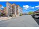 Exterior of building with private parking and well maintained landscaping on a bright sunny day at 16631 E El Lago Blvd # 212, Fountain Hills, AZ 85268