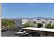 Modern townhomes with mountains in the background, carport parking, and lush trees under a clear blue sky at 16631 E El Lago Blvd # 212, Fountain Hills, AZ 85268