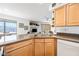 Bright kitchen features granite countertops and stainless sink; open to living area with lots of natural light at 16631 E El Lago Blvd # 212, Fountain Hills, AZ 85268