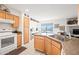 Bright kitchen featuring granite counters, light wood cabinets, and a dining area with beautiful views at 16631 E El Lago Blvd # 212, Fountain Hills, AZ 85268