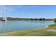 Scenic lake view with a fountain surrounded by lush landscaping and clear blue skies at 16631 E El Lago Blvd # 212, Fountain Hills, AZ 85268