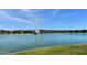 Beautiful lake view with a water fountain surrounded by lush landscaping on a bright day at 16631 E El Lago Blvd # 212, Fountain Hills, AZ 85268