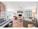 Cozy living room featuring hardwood floors, a comfortable sofa, and a large window with scenic views at 16631 E El Lago Blvd # 212, Fountain Hills, AZ 85268