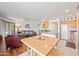 Open living and kitchen area with dining table, hardwood floors, and plenty of room for entertaining at 16631 E El Lago Blvd # 212, Fountain Hills, AZ 85268