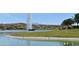 Scenic pond view with fountain, ducks and mountains, creating a picturesque setting at 16631 E El Lago Blvd # 212, Fountain Hills, AZ 85268