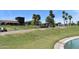 A scenic pond view with lush landscaping, creating a serene environment at 16631 E El Lago Blvd # 212, Fountain Hills, AZ 85268