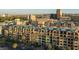 Condominium exterior with balconies in urban setting with lush trees and an enhanced balcony view at 17 W Vernon Ave # 412, Phoenix, AZ 85003