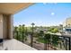 Cityscape view from the large private balcony with wrought iron railings and comfortable seating at 17 W Vernon Ave # 412, Phoenix, AZ 85003