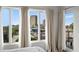 View of downtown from the large bedroom windows, adorned with flowing light-colored curtains at 17 W Vernon Ave # 412, Phoenix, AZ 85003
