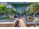 Beautiful courtyard featuring a covered sitting area, lush greenery, and well-maintained landscaping at 17 W Vernon Ave # 412, Phoenix, AZ 85003
