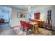 Elegant dining room with chandelier, colorful artwork and seating for six at 17 W Vernon Ave # 412, Phoenix, AZ 85003
