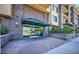 Building entrance with brick facade, awning, and glass doors leading into the lobby at 17 W Vernon Ave # 412, Phoenix, AZ 85003