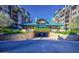 The community entrance featuring well-maintained landscaping and an underground parking entrance at 17 W Vernon Ave # 412, Phoenix, AZ 85003