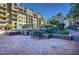 Beautiful condo building featuring a garden and seating area, creating a serene environment for residents at 17 W Vernon Ave # 412, Phoenix, AZ 85003