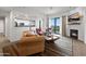 Bright living room featuring fireplace, a comfortable sofa, and a picturesque city view at 17 W Vernon Ave # 412, Phoenix, AZ 85003