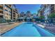 Inviting outdoor pool with lounge chairs, perfect for relaxing and enjoying the community amenities at 17 W Vernon Ave # 412, Phoenix, AZ 85003