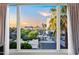 Scenic neighborhood view showcasing cityscape with palm trees, captured through a large window at 17 W Vernon Ave # 412, Phoenix, AZ 85003