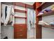 Spacious walk-in closet with custom shelving and drawers for ample storage at 17 W Vernon Ave # 412, Phoenix, AZ 85003