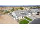 Gorgeous aerial view of a modern home showcasing its premium roof, three car garage, and well manicured landscaping at 1704 E Melrose St, Mesa, AZ 85203
