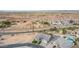 Residential neighborhood aerial view featuring nearby canal and lush agricultural land at 1704 E Melrose St, Mesa, AZ 85203