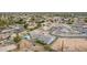 Birds eye view of homes in a neighborhood featuring well manicured lawns, pools and tree lined streets at 1704 E Melrose St, Mesa, AZ 85203
