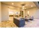 Inviting outdoor patio area with stylish furniture, a cozy fireplace, and views into the open floor plan at 1704 E Melrose St, Mesa, AZ 85203